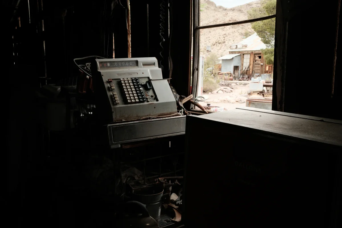Antique cash register in a dark room at Nelson Ghost Town, Eldorado Canyon, Nevada