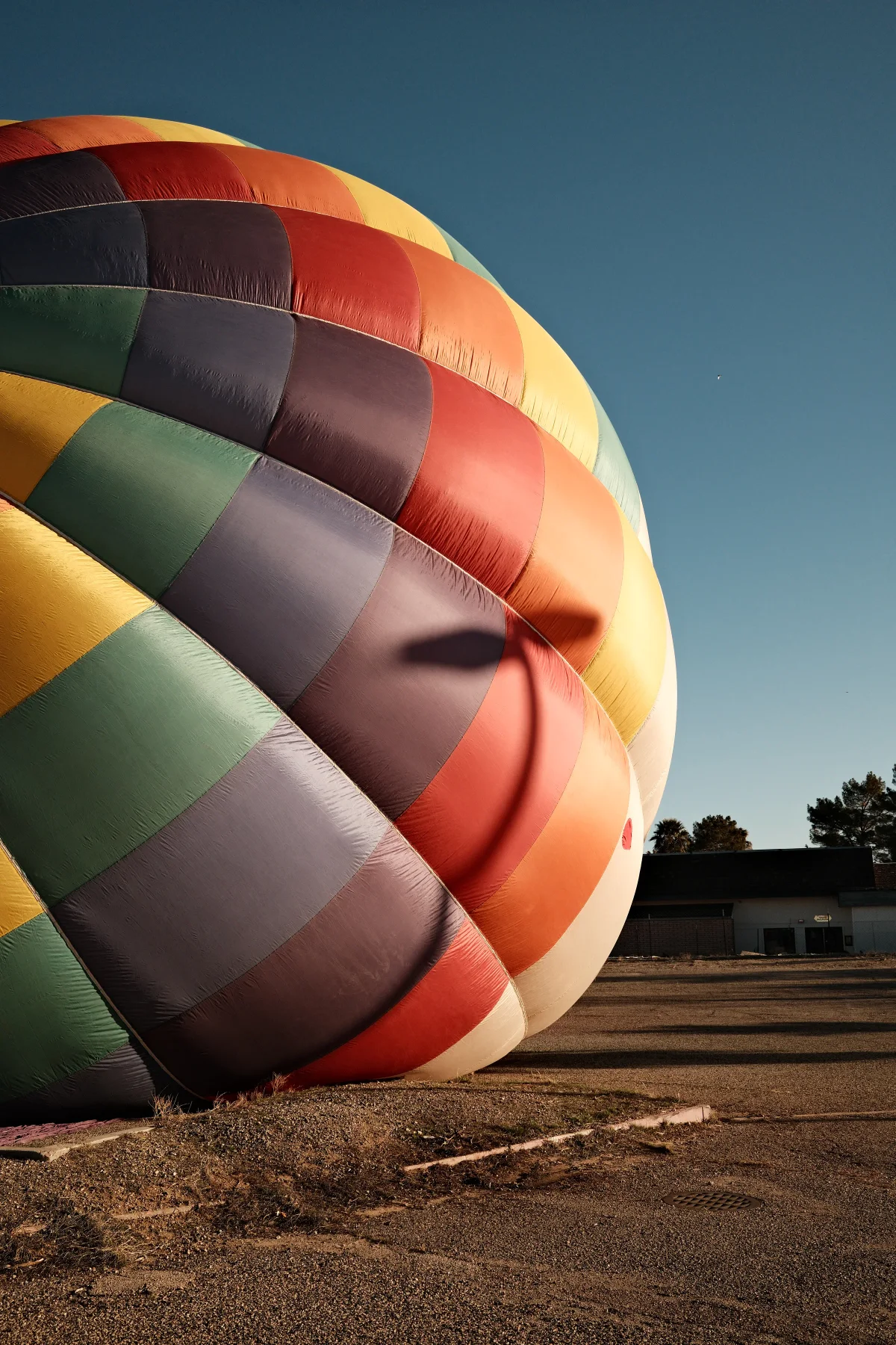 Colorful hot air balloon being inflated at dawn at the Mesquite, Nevada balloon festival
