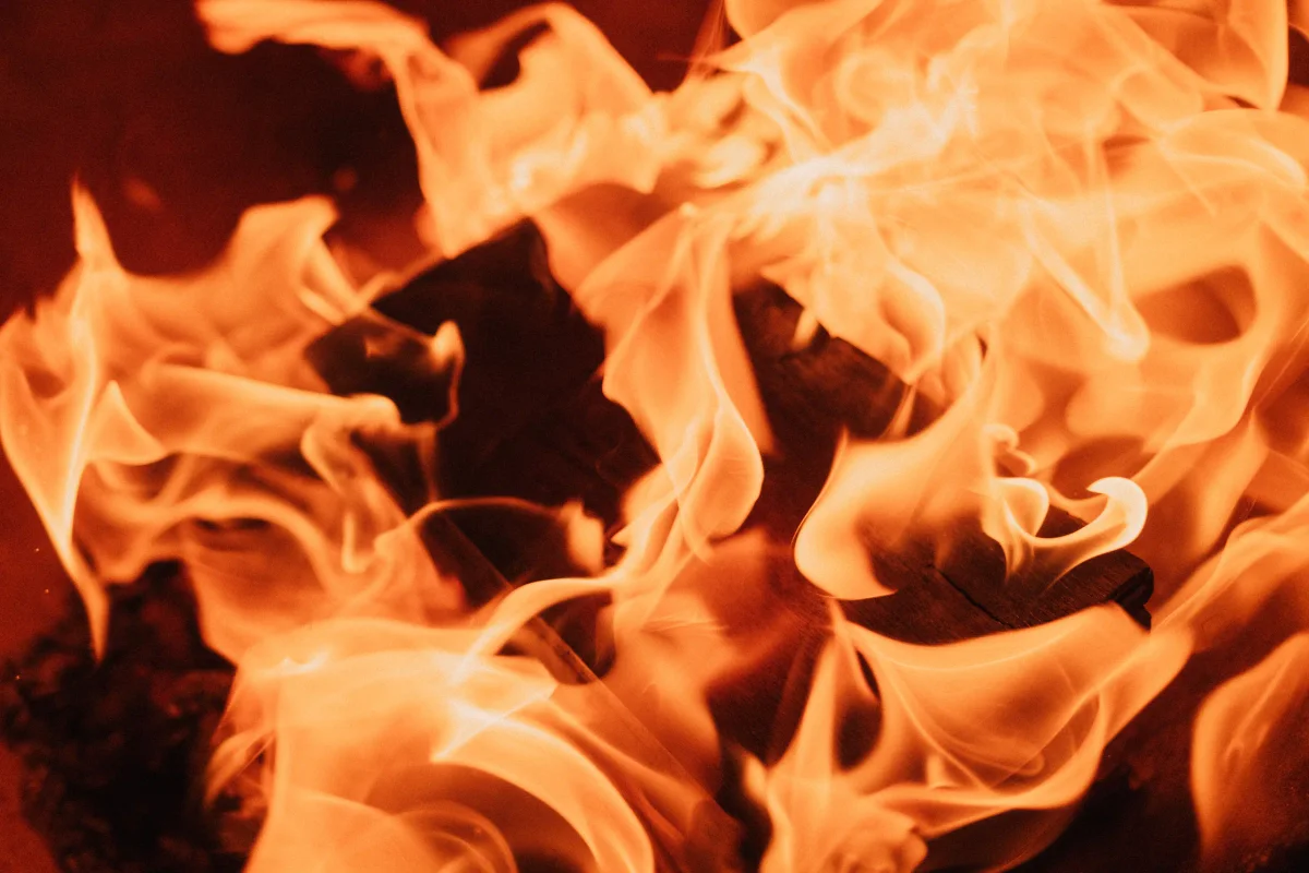 Close-up of swirling orange flames filling the frame