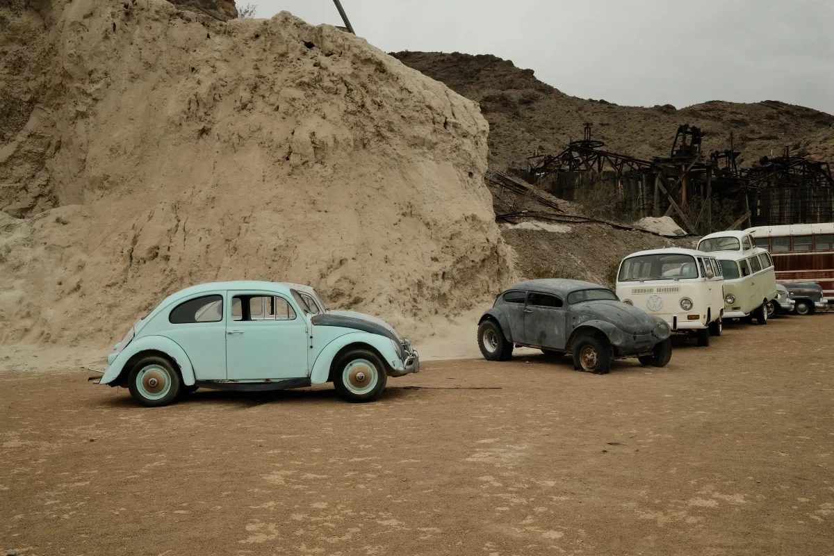 Vintage Volkswagen Beetles and VW buses lined up in Eldorado Canyon at Nelson Ghost Town, Nevada