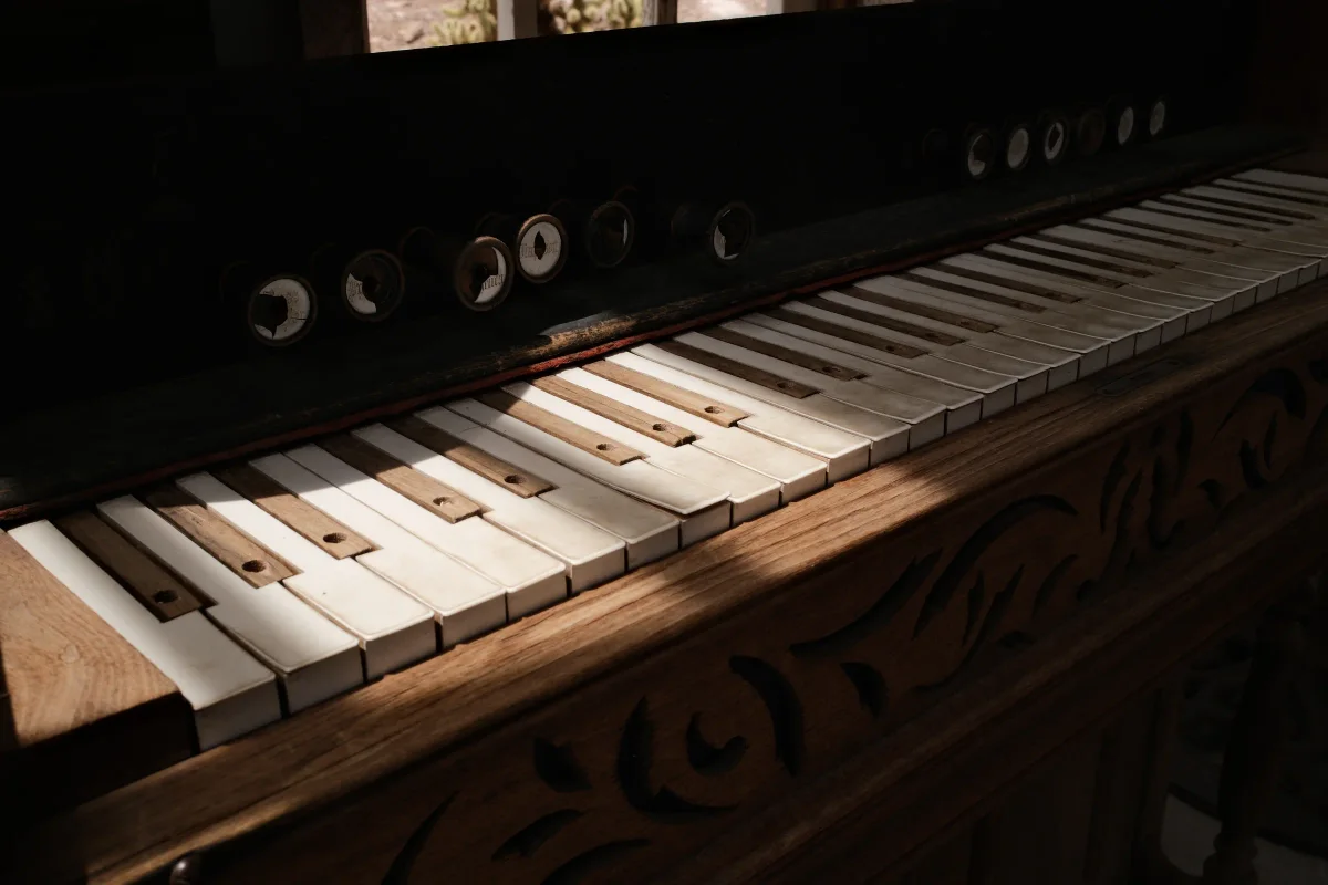 Worn ivory keys and stop knobs on an antique pump organ at Nelson Ghost Town, Nevada